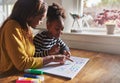 Woman and child learning alphabet