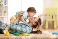 Woman with baby playing together on cozy carpet at home Royalty Free Stock Photo