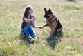 A woman with a child with German Shepherd training Royalty Free Stock Photo