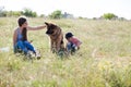 A woman with a child with German Shepherd training Royalty Free Stock Photo