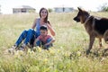 A woman with a child with German Shepherd training Royalty Free Stock Photo