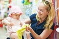 Woman with child in shop Royalty Free Stock Photo