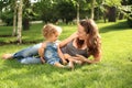 Woman with child in summer park Royalty Free Stock Photo