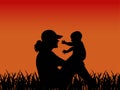 Woman with child on sunset background silhouette