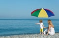 Woman with child under umbrella Royalty Free Stock Photo