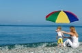 Woman and child under umbrella Royalty Free Stock Photo