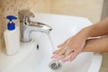 Woman washes hands from a coronavirus . Hygiene for washing hands from germs and viruses