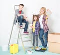 Woman and children painting wall Royalty Free Stock Photo