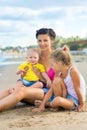 Woman with children playing on the beach Royalty Free Stock Photo