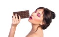 Woman and chocolate. Beautiful young woman is eating chocolate o Royalty Free Stock Photo