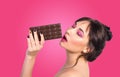 Woman and chocolate. Beautiful young woman is eating chocolate Royalty Free Stock Photo