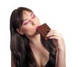 Woman and chocolate. Beautiful young woman is eating chocolate o Royalty Free Stock Photo