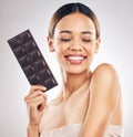 Woman, chocolate and thinking of diet for skincare, beauty and health or wellness on a white background. Young person or