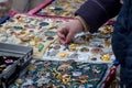 Woman choose the antique brooch at the flea market Royalty Free Stock Photo