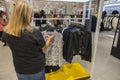 Woman chooses blouse in department store at Macy\'s. NY.