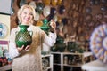 Woman chooses ceramic Royalty Free Stock Photo