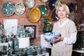 Woman chooses ceramic Royalty Free Stock Photo