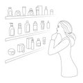 Woman chooses cosmetics and perfumery.