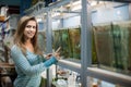 Woman chooses fish at pet-shop Royalty Free Stock Photo