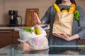 Woman chooses a paper bag with food and refuses to use plastic. Environmental protection and the abandonment of plastic