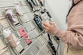 A woman chooses an epilator in the store Royalty Free Stock Photo