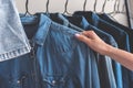 Woman choosing article of denim clothes