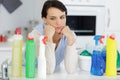 Woman choosing betwwen cleaning products