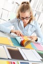 Woman choosing color with colors sampler Royalty Free Stock Photo