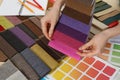 Woman choosing among colorful fabric samples, closeup Royalty Free Stock Photo