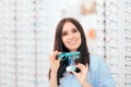 Girl Comparing Contacts to Eyeglasses for Vision Correction Royalty Free Stock Photo