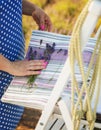 Woman choosing fabric for new curtains. Girl holds a bouquet of lavender in her hands. Fragrant lavender flowers Royalty Free Stock Photo