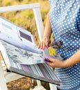 Woman choosing fabric for new curtains. Girl holds a bouquet of lavender in her hands. Fragrant lavender flowers Royalty Free Stock Photo