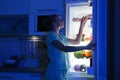 Woman choosing food from refrigerator Royalty Free Stock Photo