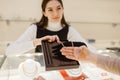 Woman choosing golden chain in jewelry store Royalty Free Stock Photo