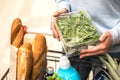 Woman choosing green leafy vegetables in grocery. Royalty Free Stock Photo