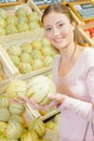 Woman choosing melon Royalty Free Stock Photo