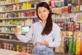 Woman choosing plastic hair curlers