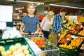 Woman choosing seasonal fruits Royalty Free Stock Photo