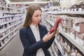 Woman choosing shoes in the shop