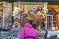 Woman choosing toys at Christmas market. woman chooses souvenirs at the Christmas market. back view. toned