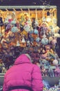 Woman choosing toys at Christmas market. woman chooses souvenirs at the Christmas market. back view. toned