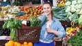 Woman is choosing vagetables with basket