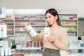 Woman choosing vitamins and supplements for immune system. coronavirus pandemic necessity Royalty Free Stock Photo