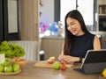 Woman chopping green and red apples, preparing healthy brunch Royalty Free Stock Photo