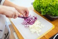 Woman chopping onions