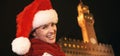 Woman in Christmas hat in front of Palazzo Vecchio in Florence Royalty Free Stock Photo