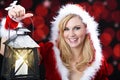 Woman with christmas hat and lantern