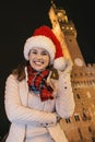 Woman in Christmas hat near Palazzo Vecchio in Florence, Italy Royalty Free Stock Photo