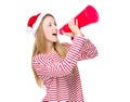 Woman with christmas hat and shout with megaphone Royalty Free Stock Photo