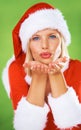 Woman, Christmas holiday and kiss as portrait for festive celebration, season greeting or winter vacation. Female person Royalty Free Stock Photo